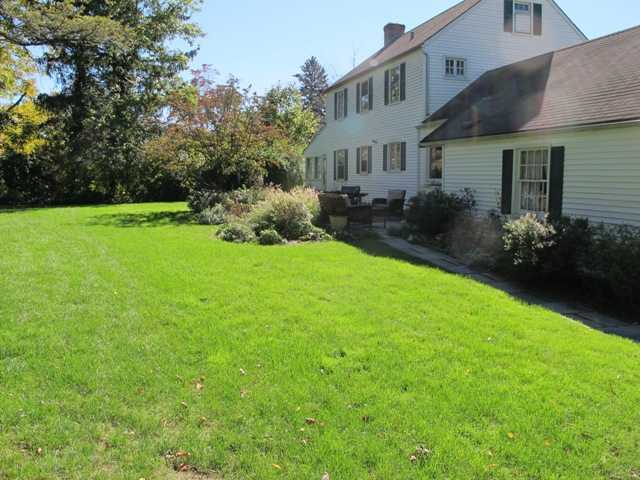 6 By Road Darien, CT 06820 - Photo 3 of 19 a view of backyard of house with green space