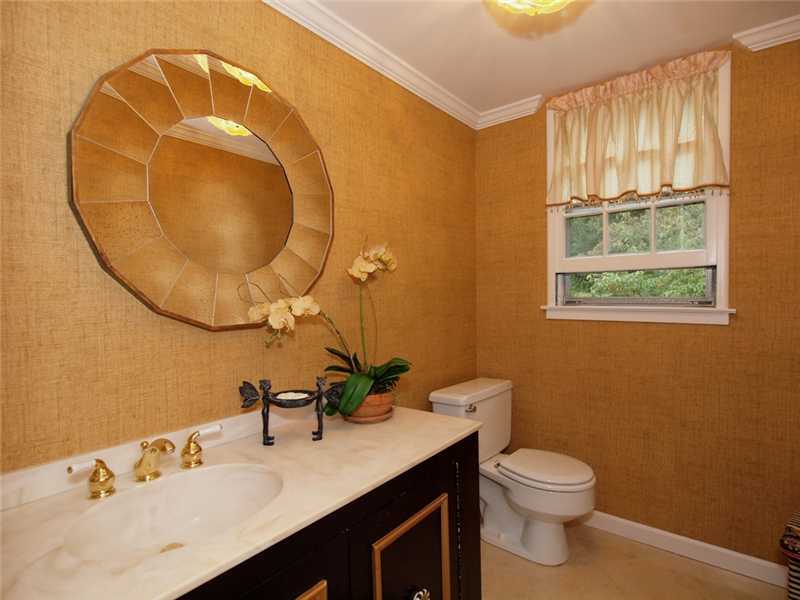 6 By Road Darien, CT 06820 - Photo 5 of 19 a bathroom with a sink mirror vanity and toilet