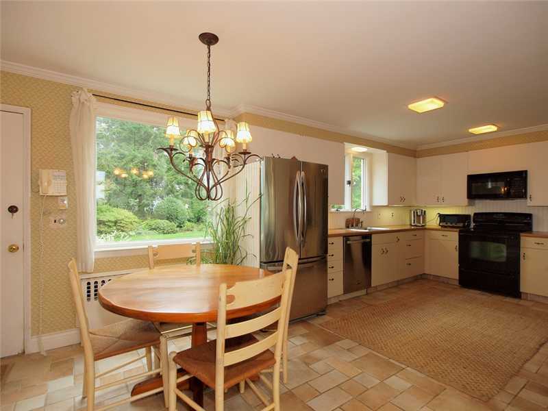 6 By Road Darien, CT 06820 - Photo 10 of 19 a kitchen with stainless steel appliances kitchen island granite countertop a refrigerator a stove top oven a sink dishwasher and chairs