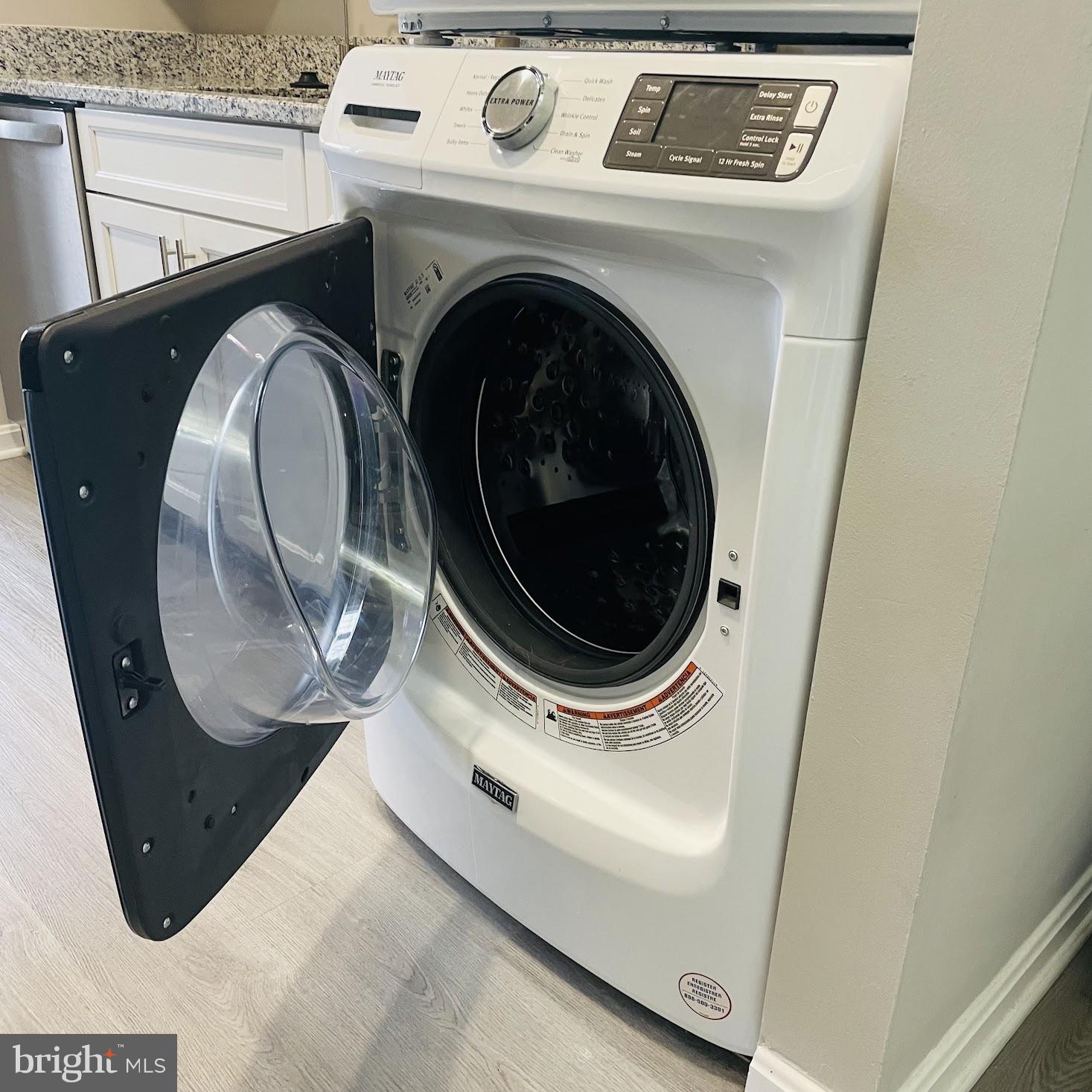 8343 Montgomery Run Road Ellicott City, MD 21043 - Photo 26 of 36 Modern washer with sleek design.