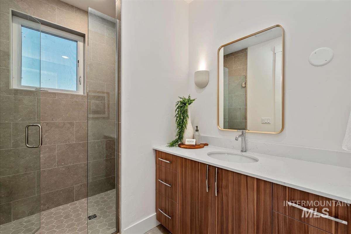 3243 West Moore Street Boise, ID 83702 - Photo 24 of 38 Full bathroom featuring vanity and a shower stall