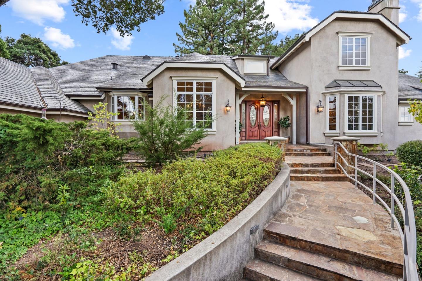 a front view of a house with a yard