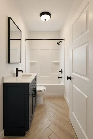 a bathroom with a bathtub shower sink vanity mirror and toilet