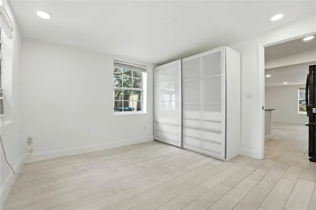 an empty room with closet area