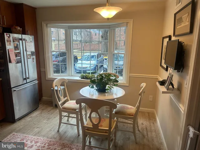 a dining room with furniture and window