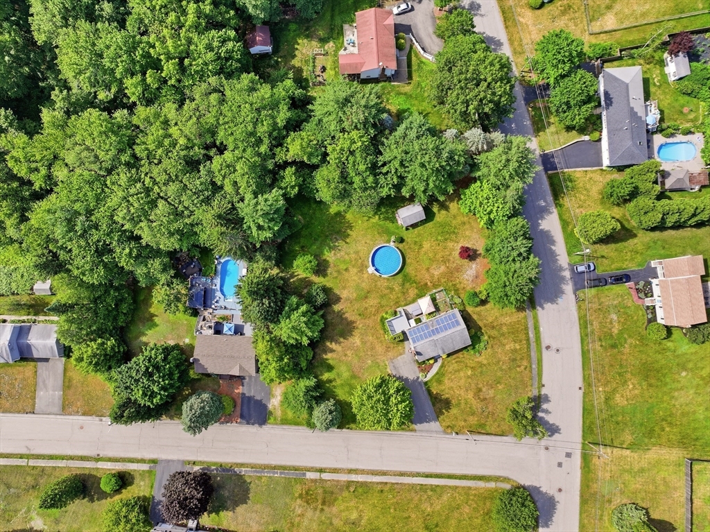 160 Navillus Road Tewksbury, MA 01876 - Photo 37 of 40 an aerial view of a house with a yard and lake view
