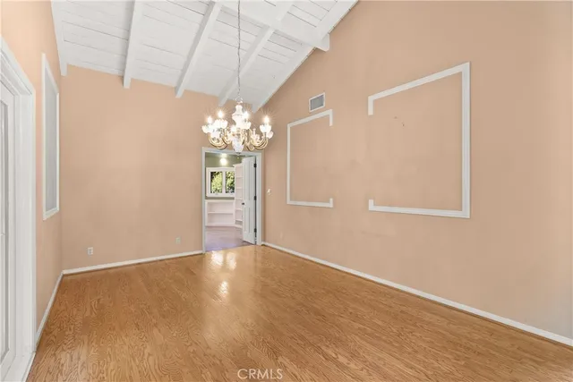 a view of a chandelier in an empty room