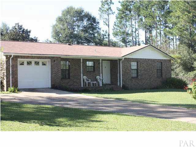 380 McKenzie Road Cantonment, FL 32533 - Photo 1 of 18 a house view with a garden space