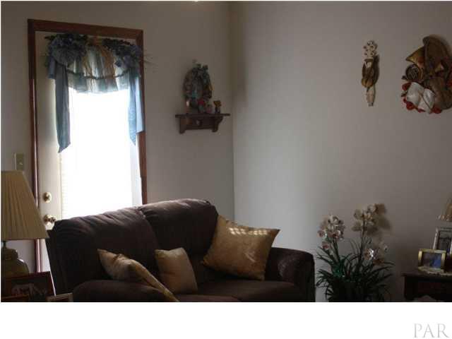 380 McKenzie Road Cantonment, FL 32533 - Photo 9 of 18 a black and white photo of a couch