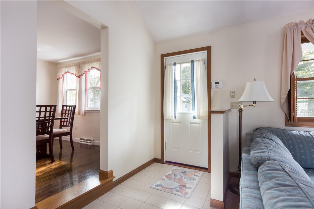 89 Viewesta Road Warwick, RI 02886 - Photo 6 of 30 This door leads into the two story family room addition with a view of the dining room to the left.