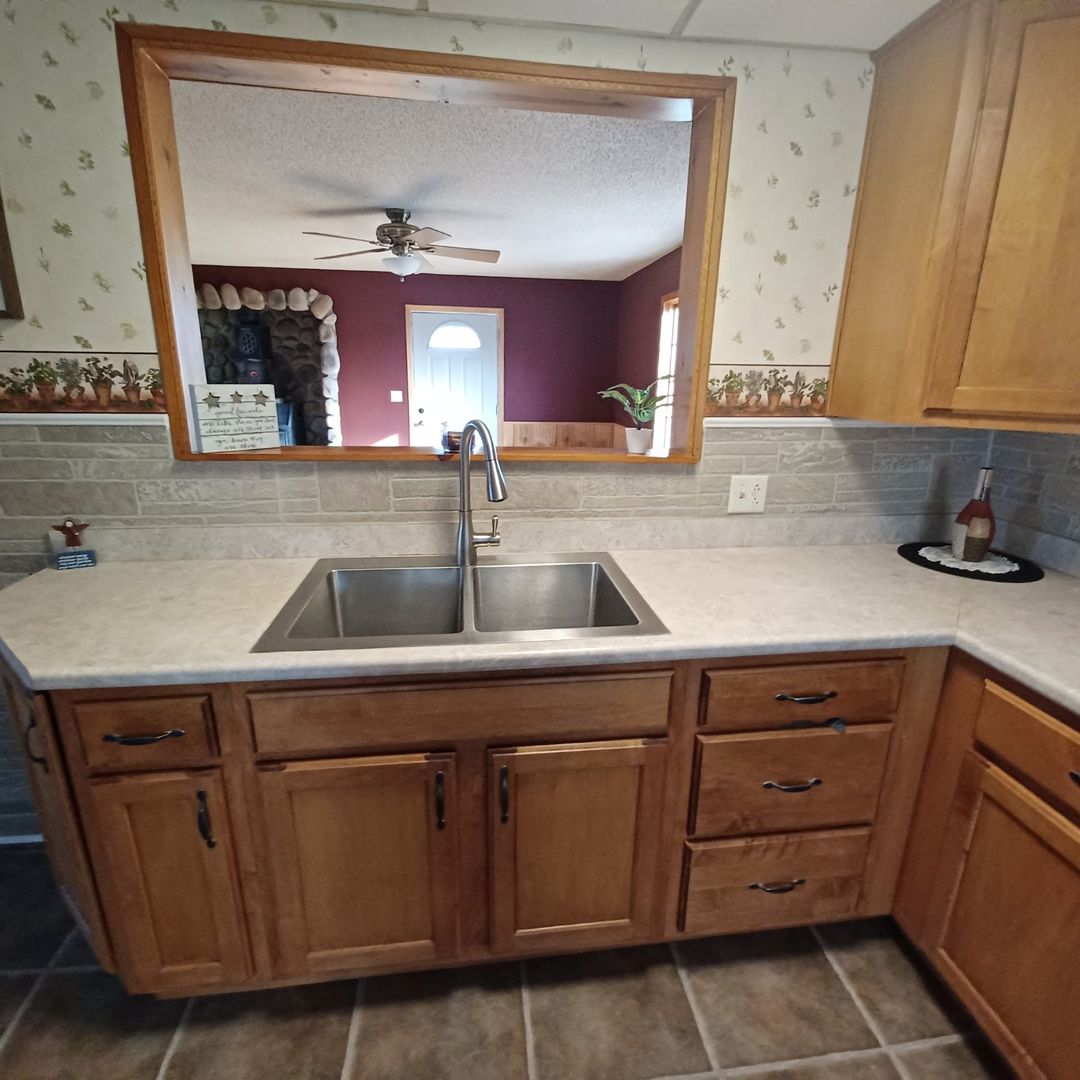 701 East 9th Street Kewanee, IL 61443 - Photo 19 of 56 a kitchen with a sink and cabinets