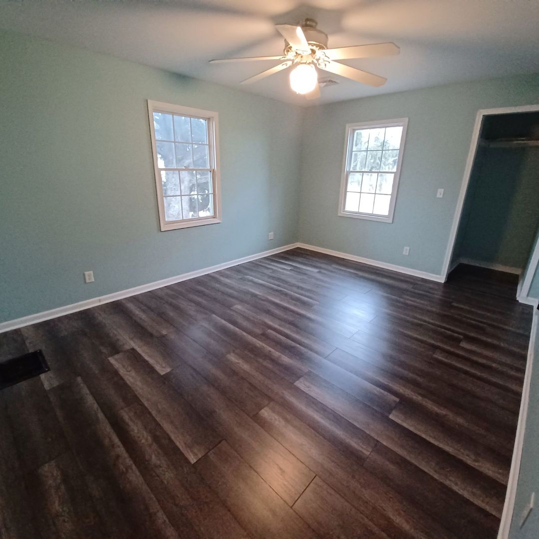 701 East 9th Street Kewanee, IL 61443 - Photo 45 of 56 a view of an empty room with wooden floor and a window