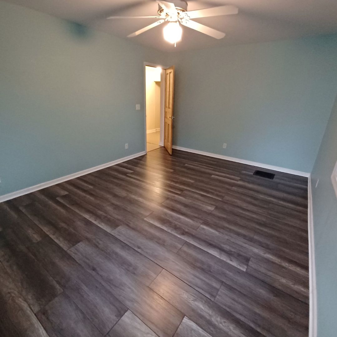 701 East 9th Street Kewanee, IL 61443 - Photo 47 of 56 a view of an empty room with wooden floor and a window