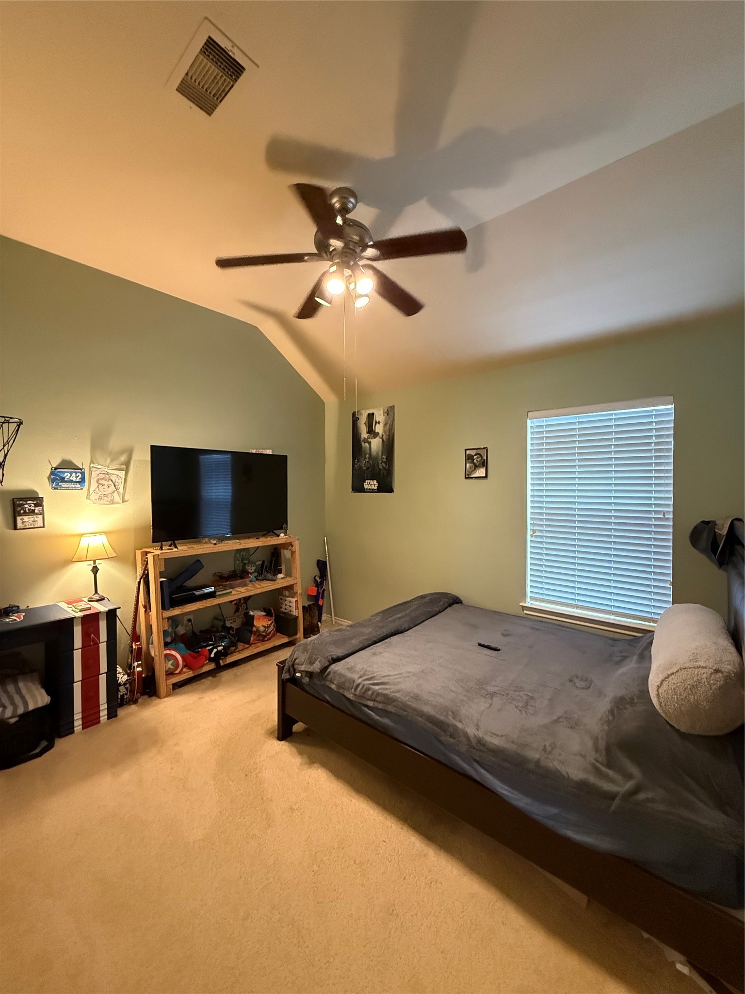 2327 Kylie Court Spring, TX 77386 - Photo 11 of 15 a bedroom with a bed and a flat screen tv