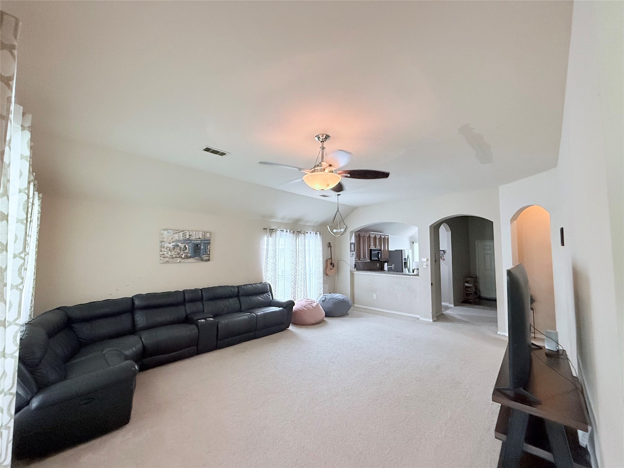 2327 Kylie Court Spring, TX 77386 - Photo 6 of 15 a living room with furniture a chandelier and a window