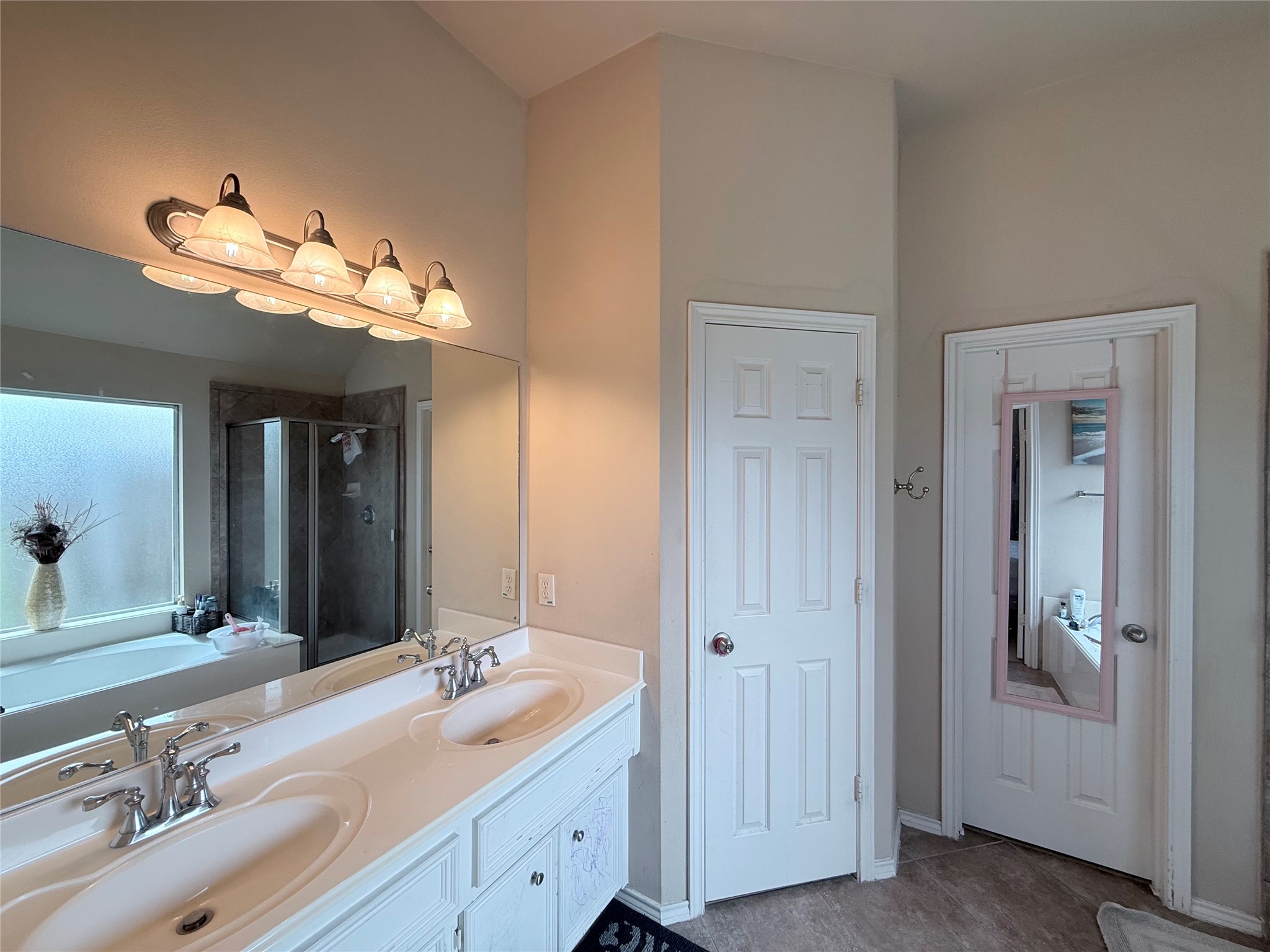 2327 Kylie Court Spring, TX 77386 - Photo 8 of 15 a bathroom with a double vanity sink and a mirror