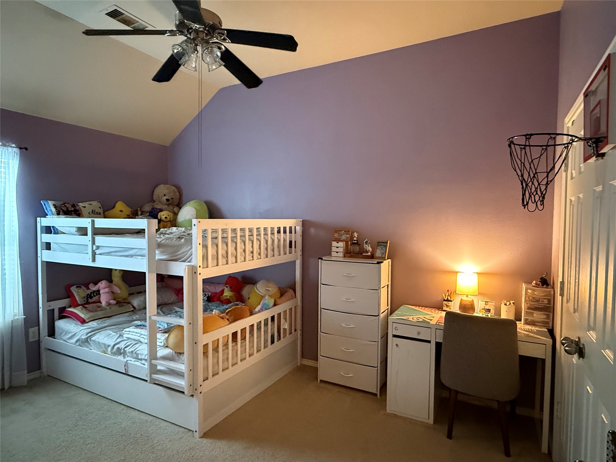 2327 Kylie Court Spring, TX 77386 - Photo 10 of 15 a bedroom with furniture and a chandelier