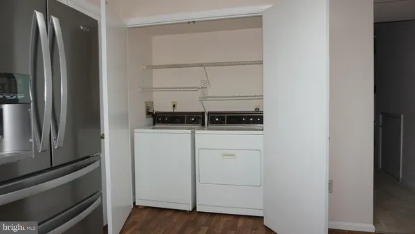 a kitchen with white cabinets and a stove