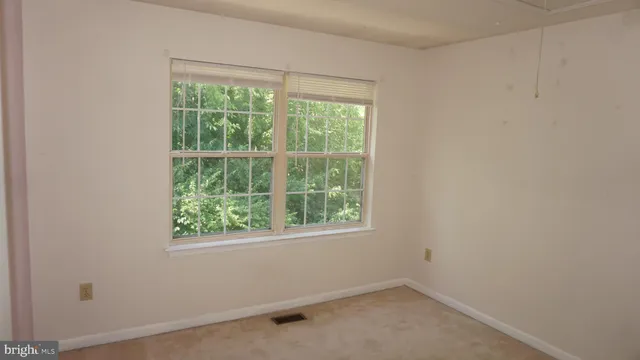 an empty room with closet area