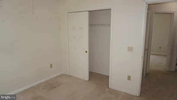 a bathroom with a shower a toilet and a sink