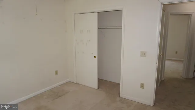 a bathroom with a shower a toilet and a sink