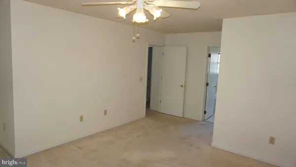 a view of a chandelier fan in a room