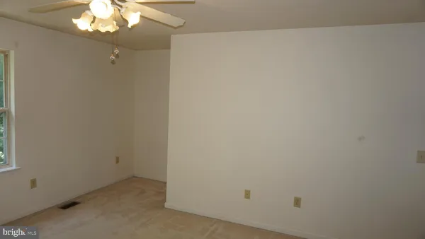 a view of a bathroom from a hallway