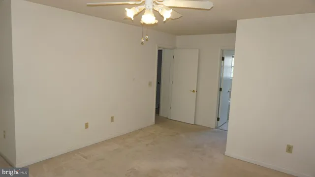 a view of a chandelier fan in a room