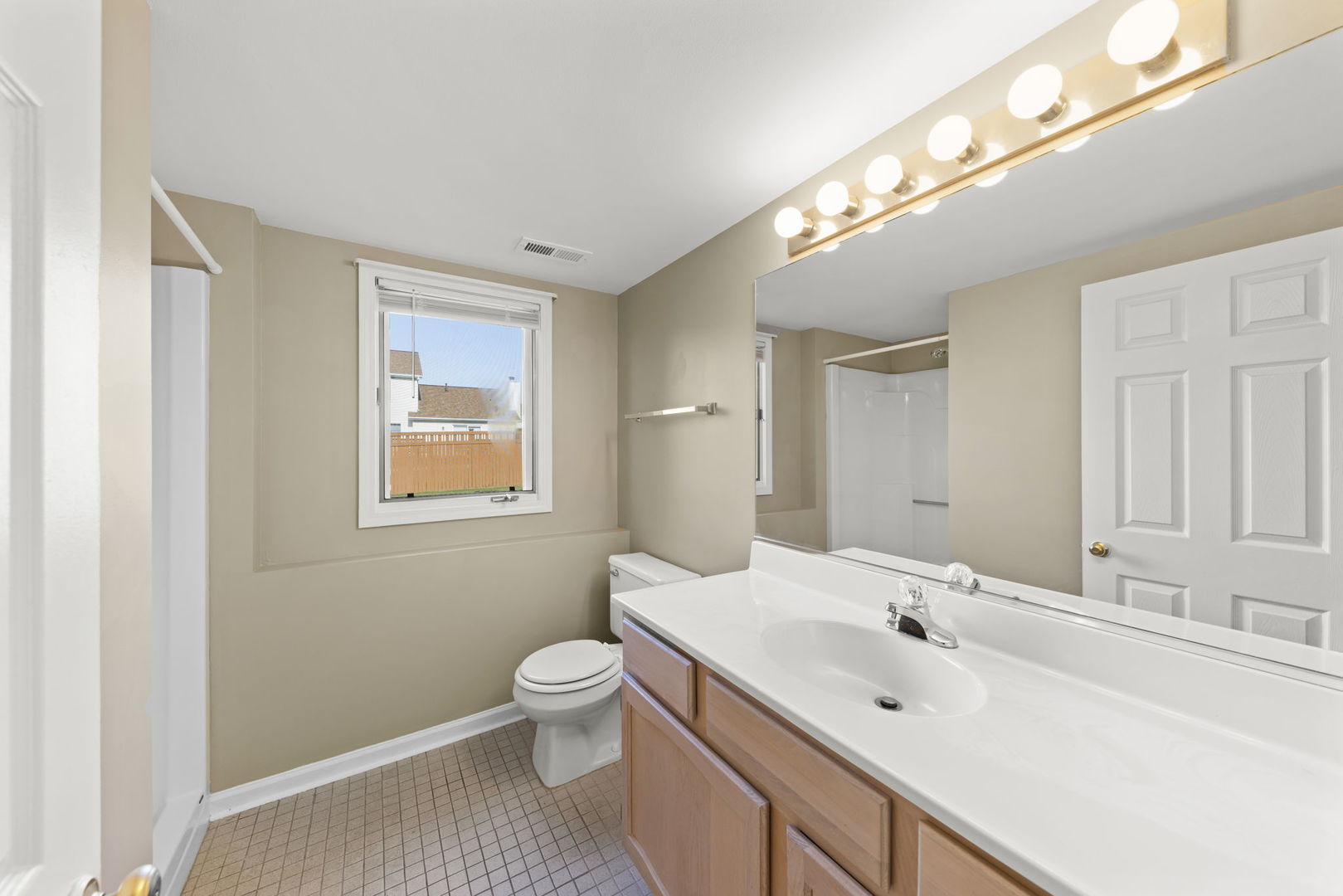 1925 William Drive Crest Hill, IL 60403 - Photo 21 of 32 a bathroom with a sink a toilet and mirror