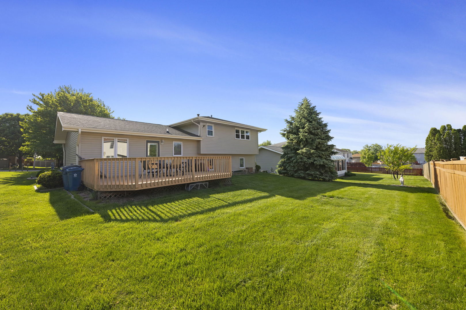 1925 William Drive Crest Hill, IL 60403 - Photo 25 of 32 a view of a house with a yard deck and a small yard