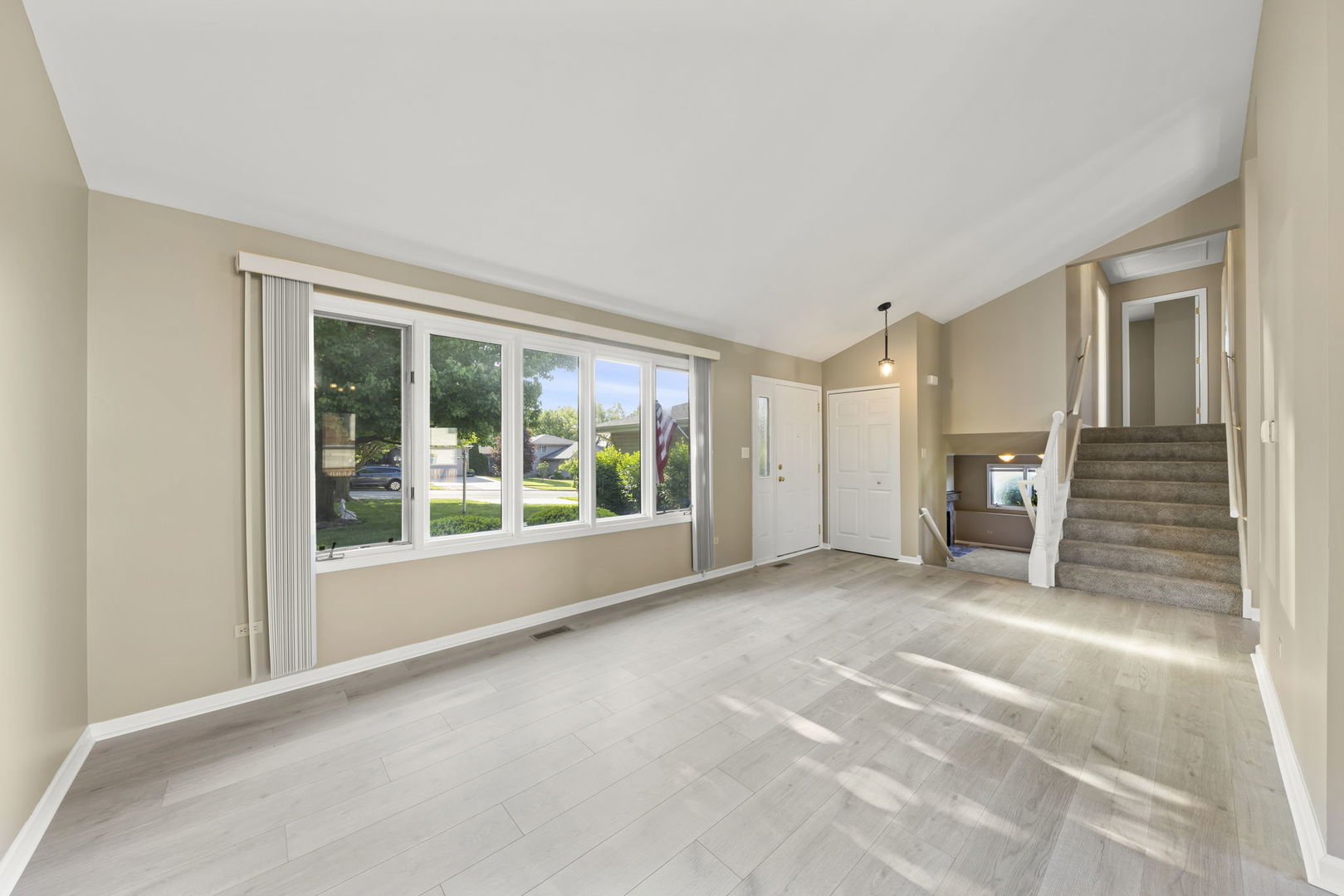 1925 William Drive Crest Hill, IL 60403 - Photo 4 of 32 a view of a big room with windows and entryway