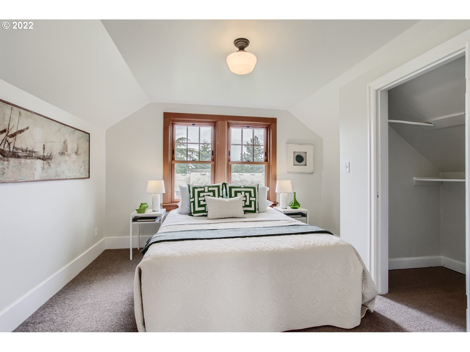 4347 Northeast Sumner Street Portland, OR 97218 - Photo 14 of 25 a bedroom with a bed and a potted plant