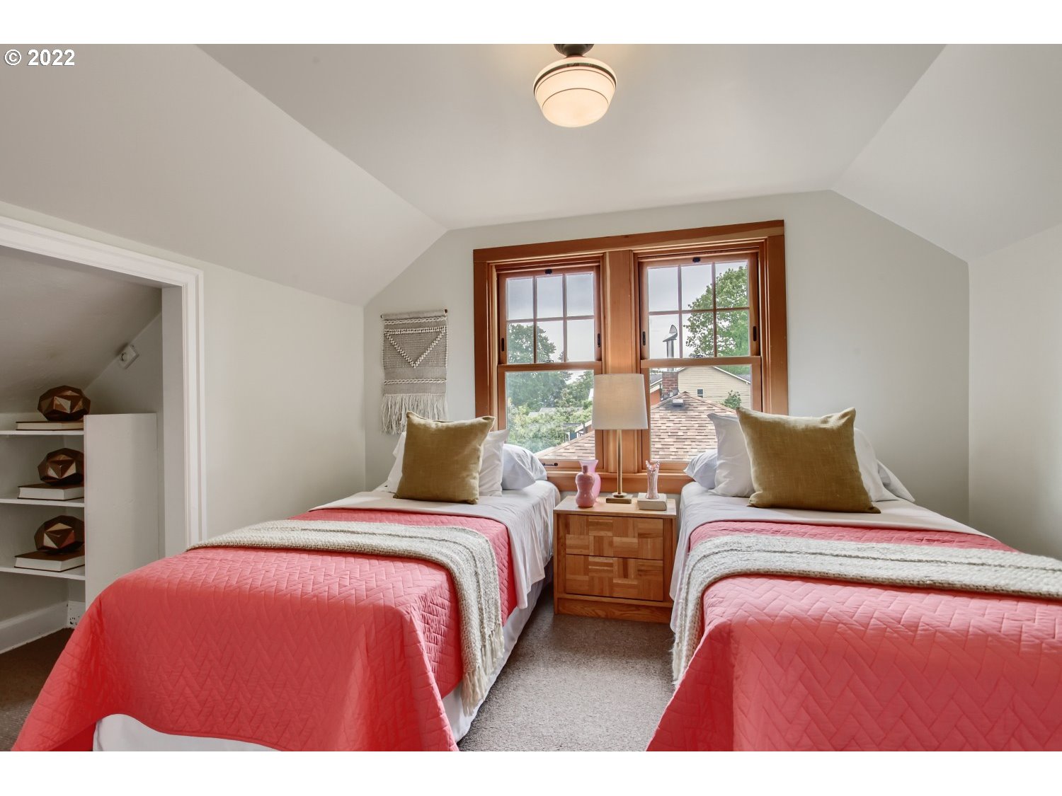 4347 Northeast Sumner Street Portland, OR 97218 - Photo 15 of 25 a bedroom with a bed and with a large window