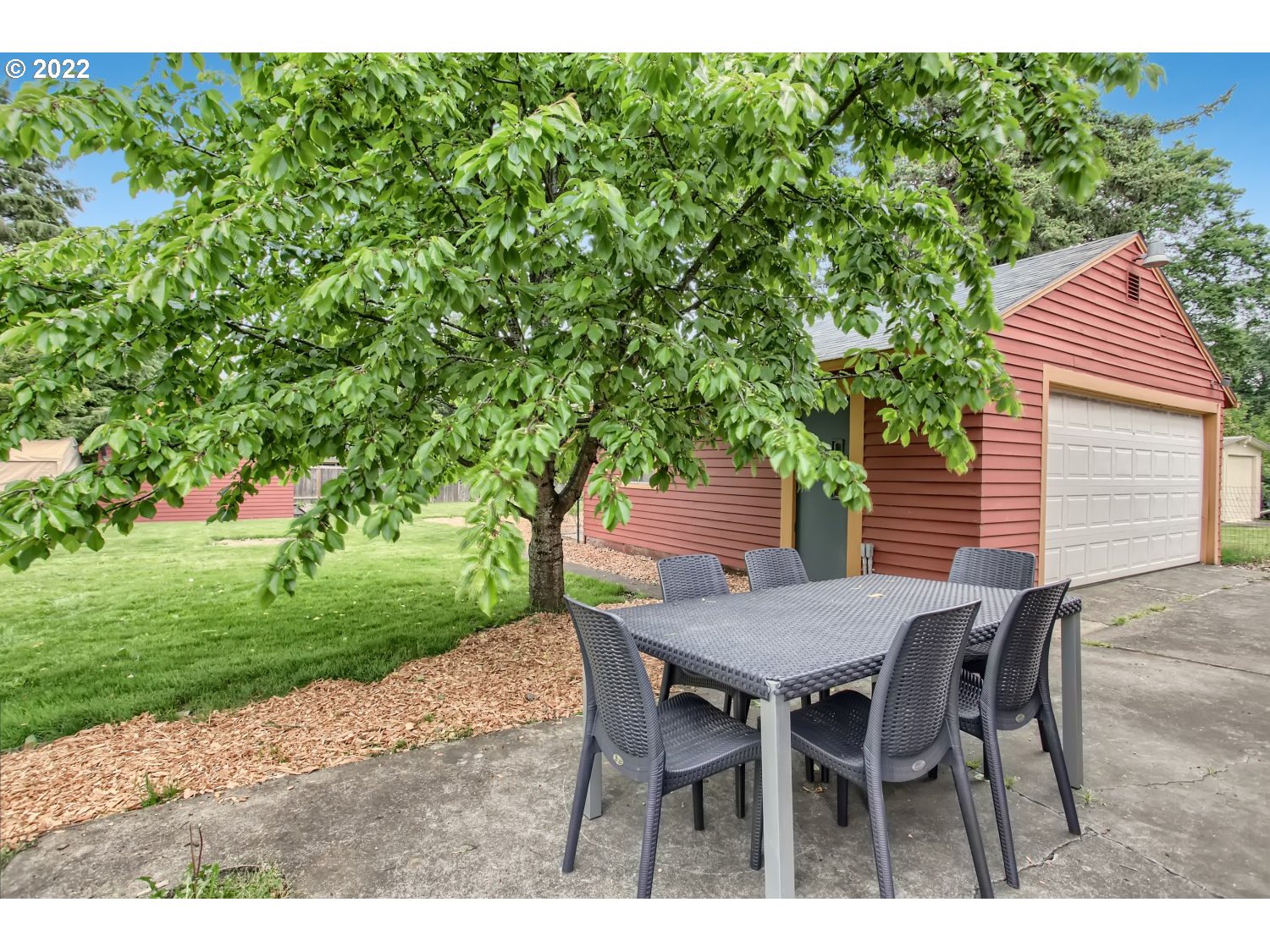 4347 Northeast Sumner Street Portland, OR 97218 - Photo 17 of 25 a view of an outdoor space with a table and chairs