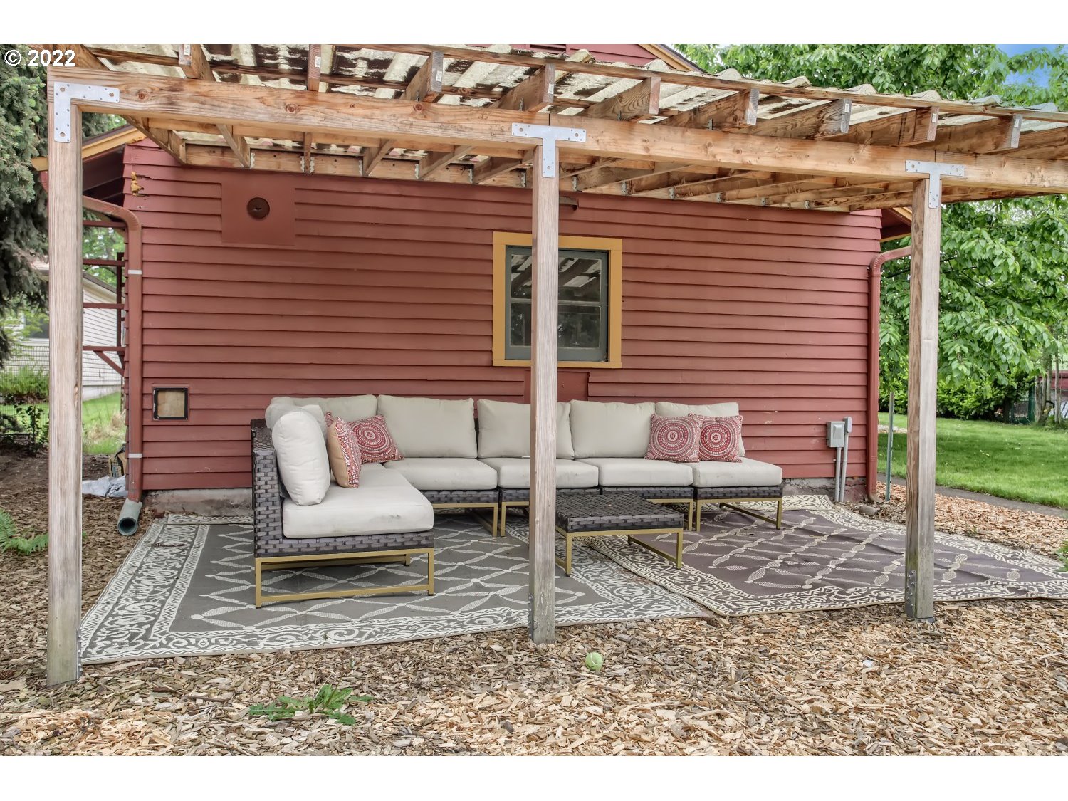 4347 Northeast Sumner Street Portland, OR 97218 - Photo 18 of 25 a view of a patio with a table and chairs