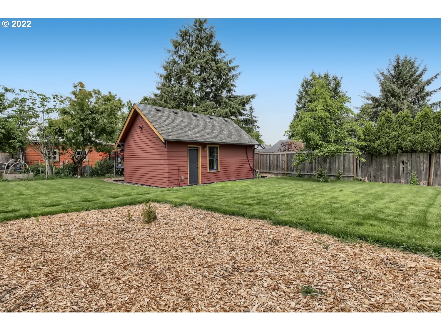 4347 Northeast Sumner Street Portland, OR 97218 - Photo 20 of 25 a front view of house with a garden