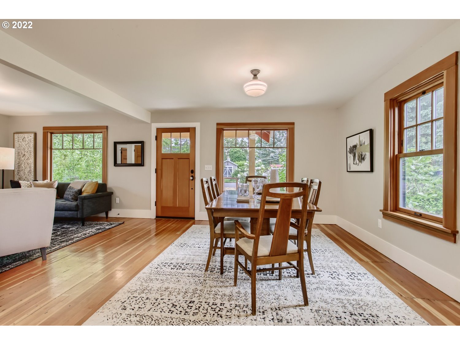 4347 Northeast Sumner Street Portland, OR 97218 - Photo 5 of 25 a dining room with furniture and wooden floor