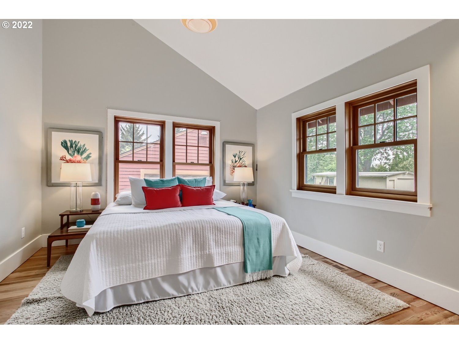 4347 Northeast Sumner Street Portland, OR 97218 - Photo 10 of 25 a bedroom with a large bed and a window