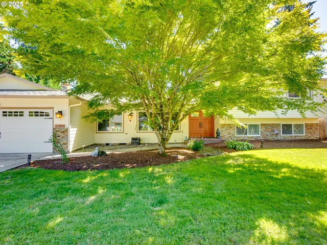 a house view with a sitting space and garden