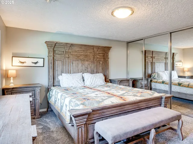 a bedroom with a bed and a dresser