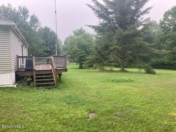 a backyard of a house with trampoline