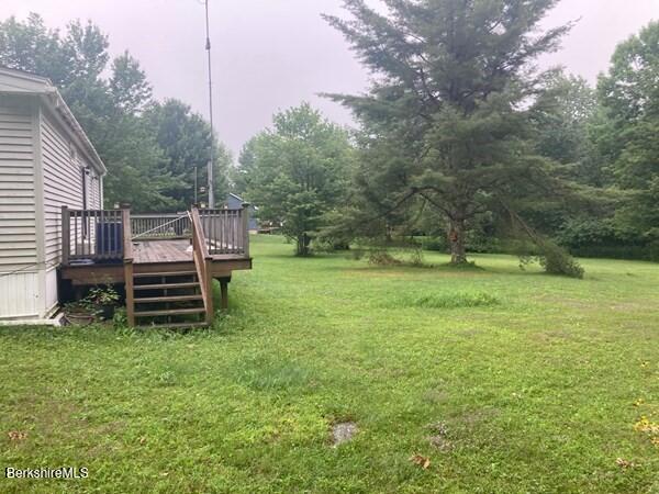 504 Loop Road Savoy, MA 01256 - Photo 2 of 10 a backyard of a house with trampoline