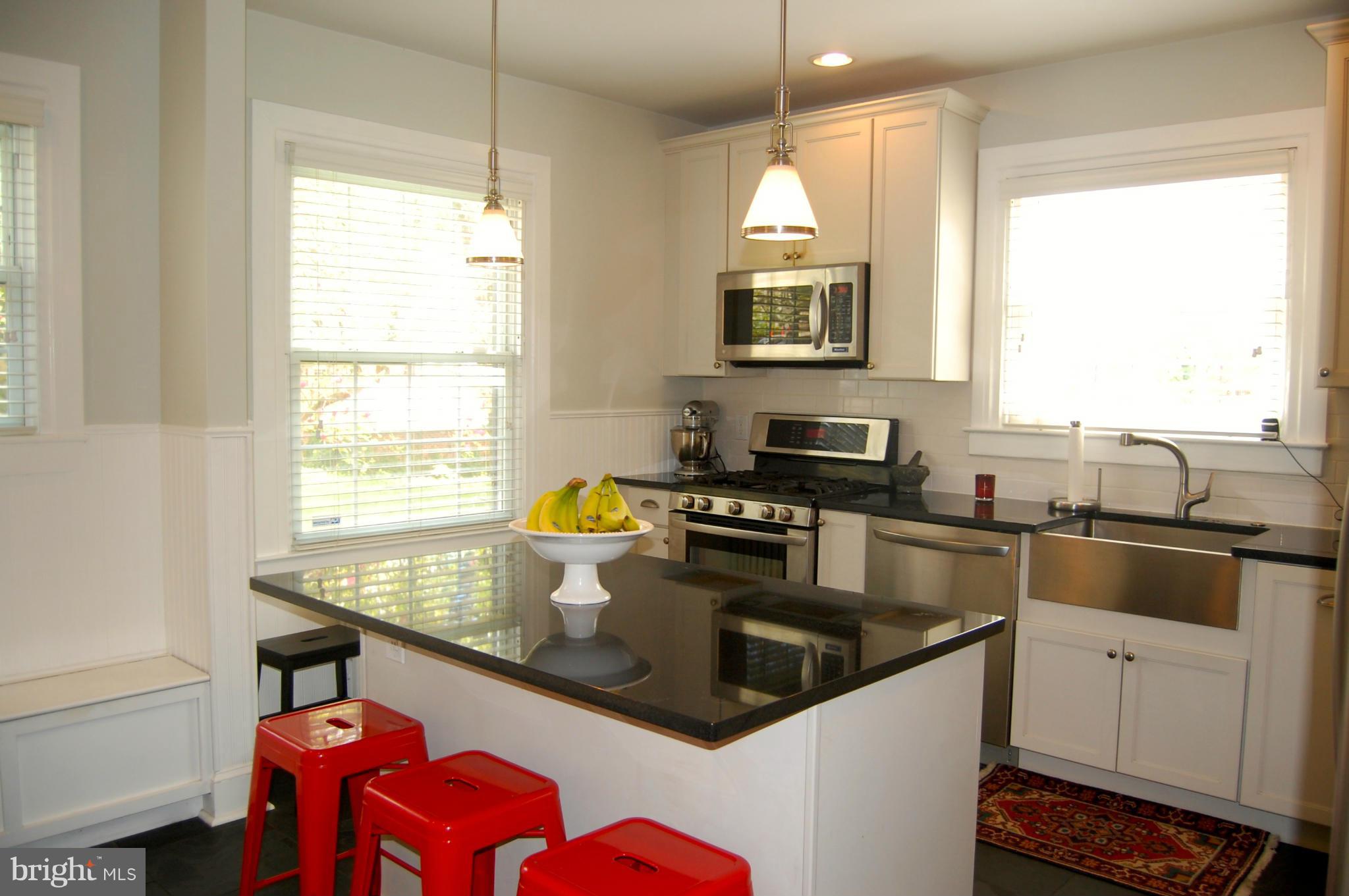345 Tunbridge Road Baltimore, MD 21212 - Photo 11 of 30 a kitchen with stainless steel appliances granite countertop a sink and a stove