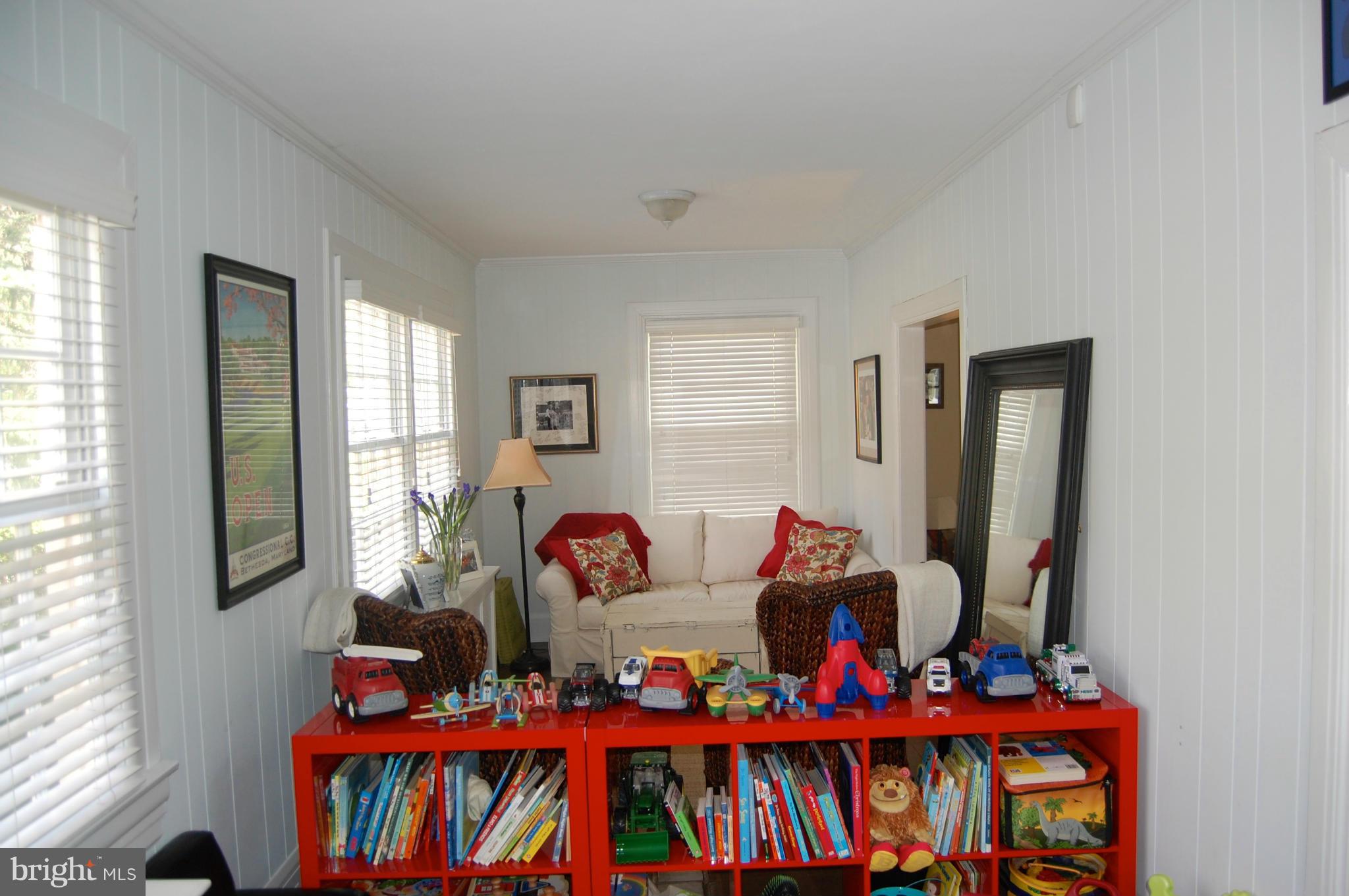 345 Tunbridge Road Baltimore, MD 21212 - Photo 15 of 30 a living room with lots of baby furniture and a window