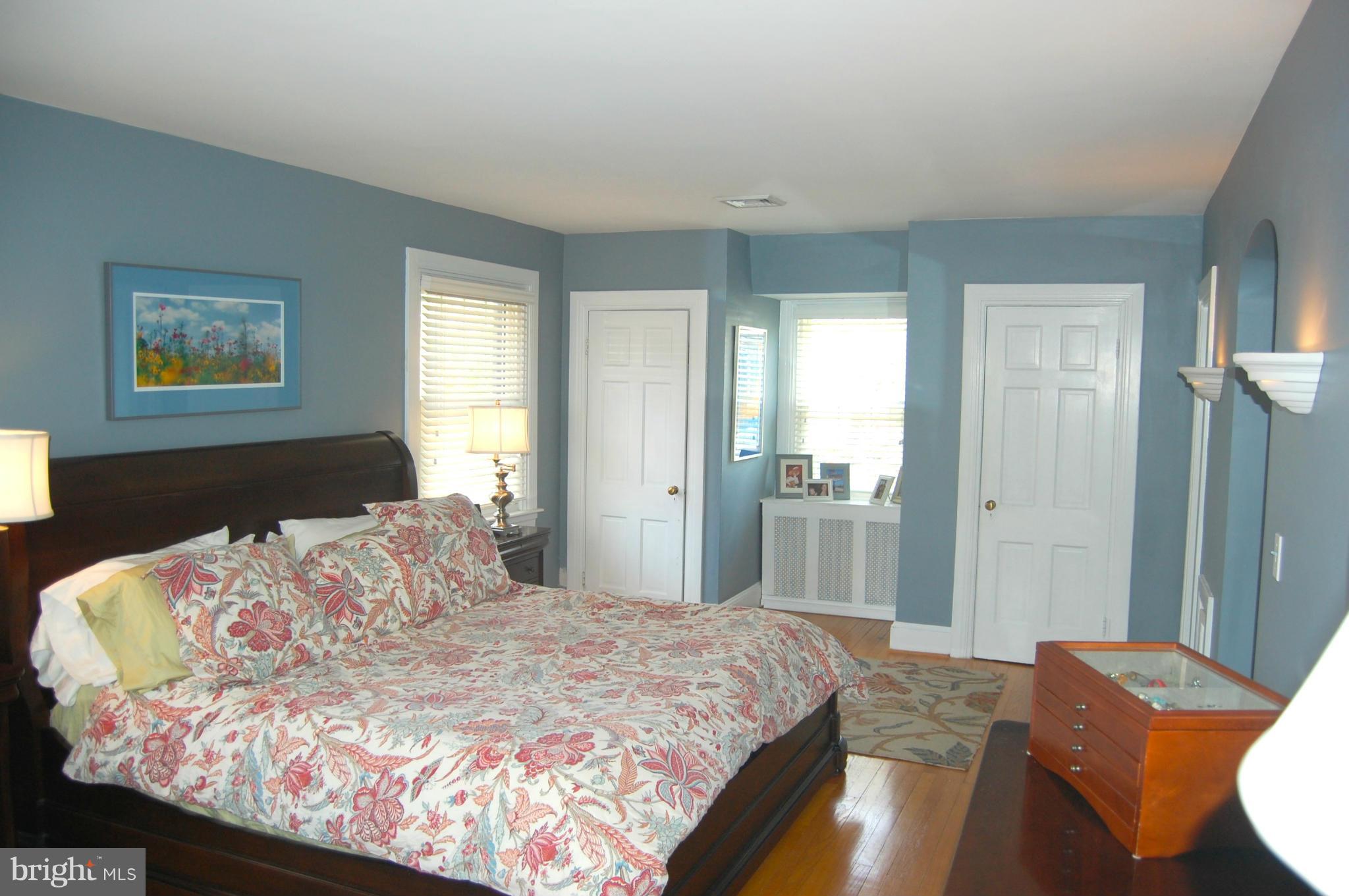 345 Tunbridge Road Baltimore, MD 21212 - Photo 18 of 30 a bedroom with a bed and wooden floor