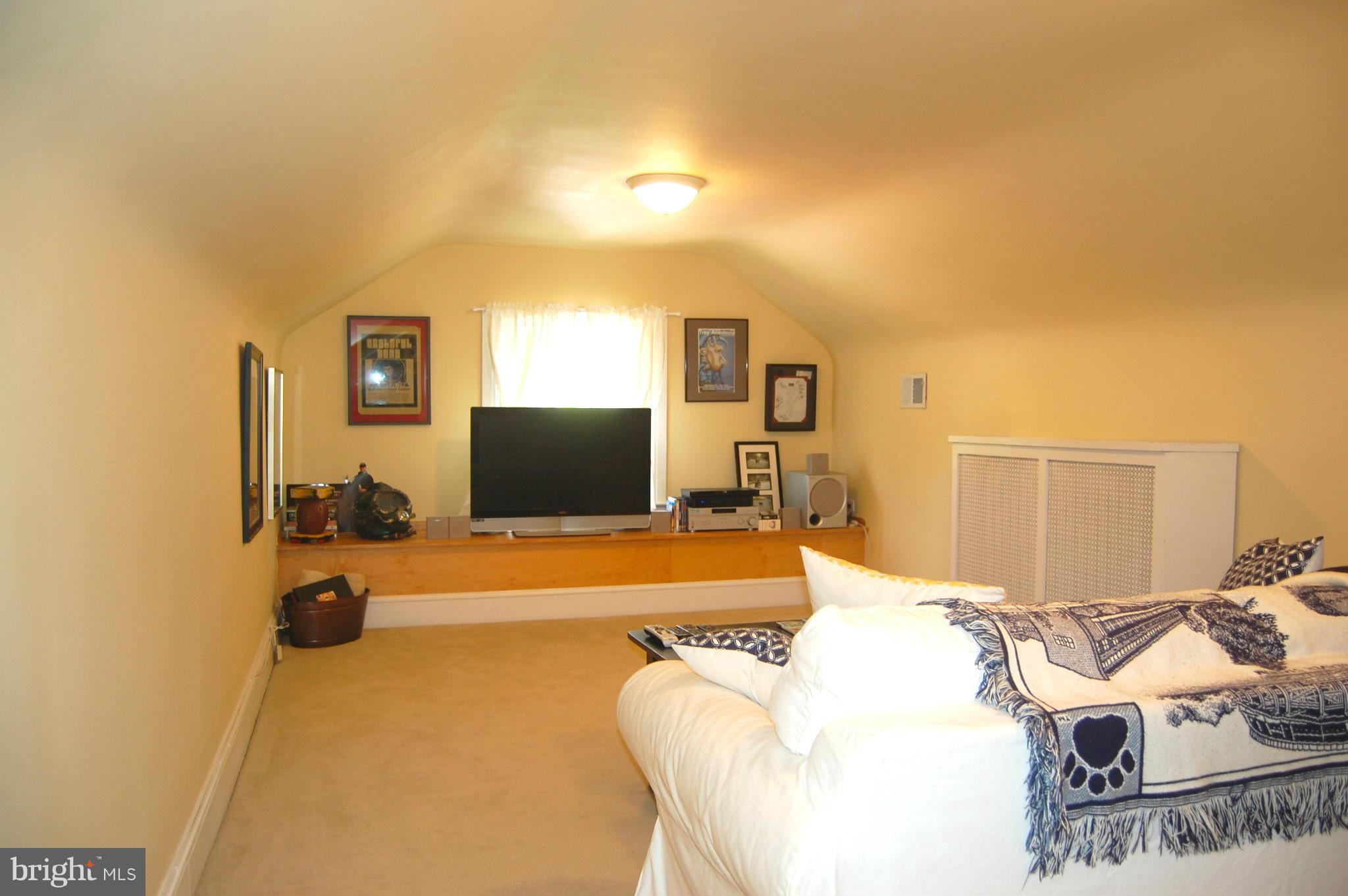 345 Tunbridge Road Baltimore, MD 21212 - Photo 27 of 30 a bedroom with a bed and a flat screen tv