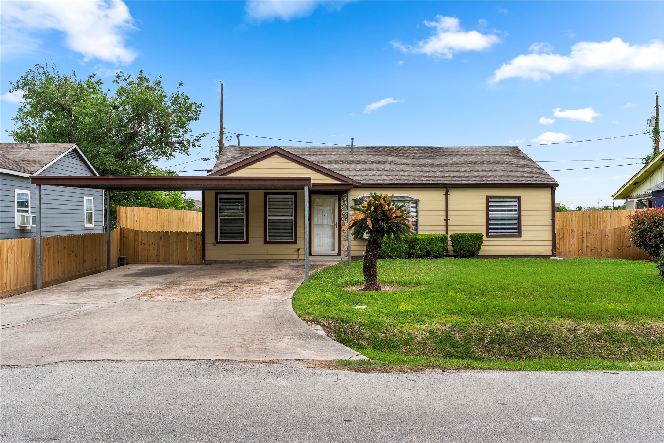 5703 Minden Street Houston, TX 77026 - Photo 2 of 20 a front view of a house with a garden and yard