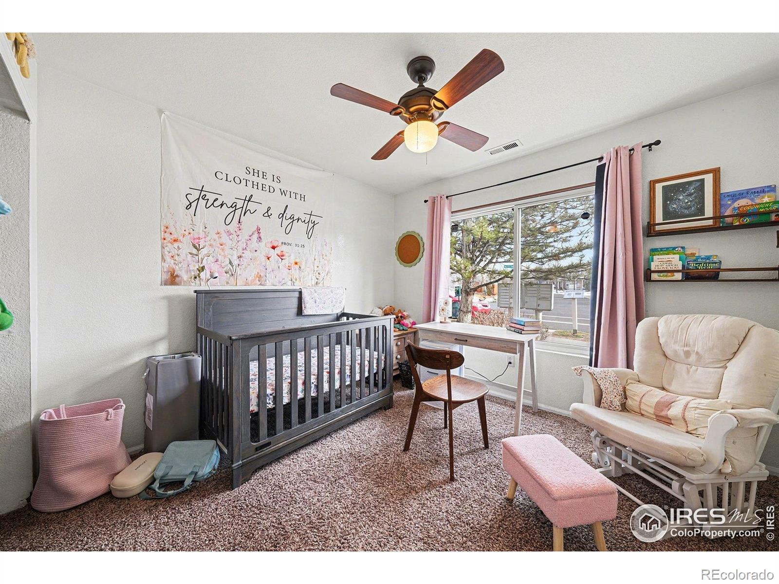 6815 Autumn Ridge Drive Fort Collins, CO 80525 - Photo 9 of 23 a living room with furniture and a window