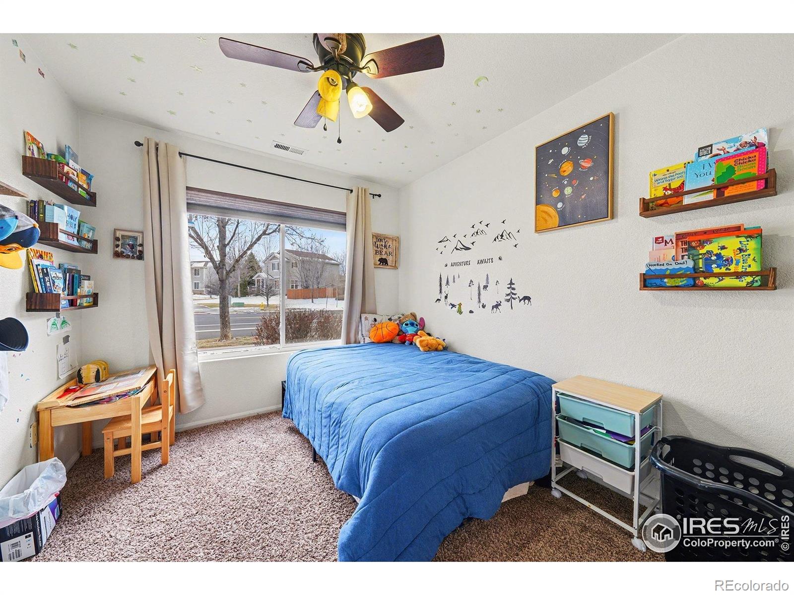 6815 Autumn Ridge Drive Fort Collins, CO 80525 - Photo 10 of 23 a bedroom with a bed and a window