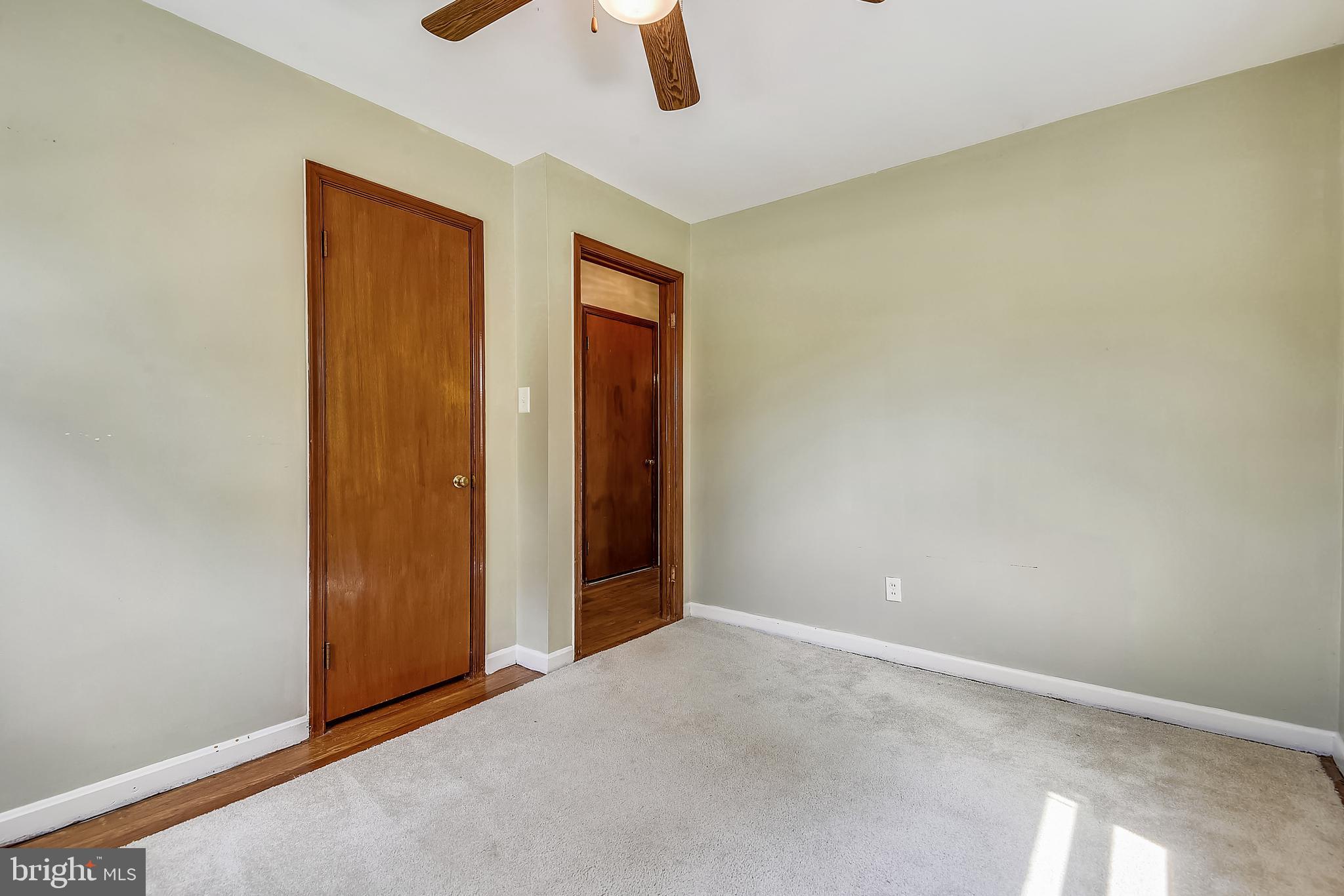 101 North Longcross Road Linthicum, MD 21090 - Photo 14 of 62 Bedroom 2 Main FLR, w/ hardwood under throw rug.